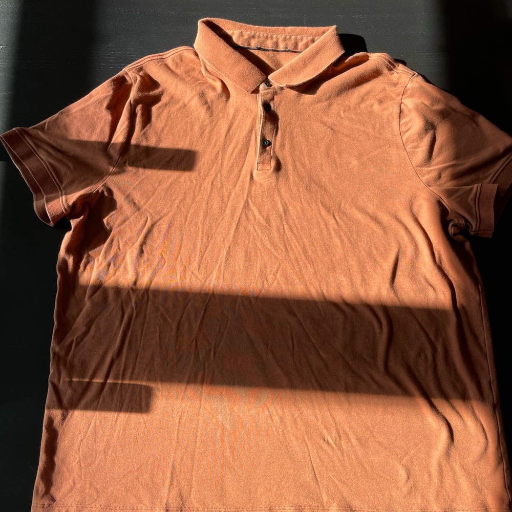 Men’s Express polo, extra large, reddish-orange